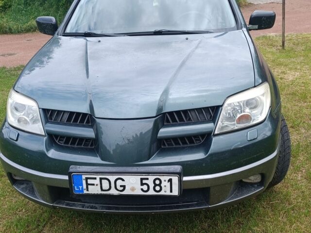 Зеленый Мицубиси Аутлендер, объемом двигателя 3 л и пробегом 220 тыс. км за 4000 $, фото 3 на Automoto.ua