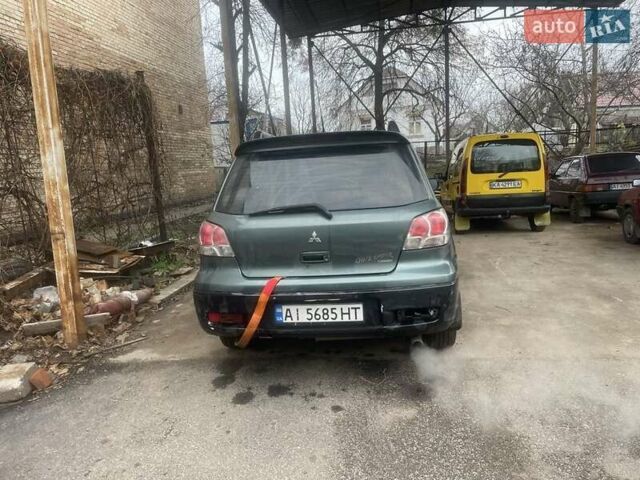 Зелений Міцубісі Аутлендер, об'ємом двигуна 2.4 л та пробігом 300 тис. км за 5000 $, фото 4 на Automoto.ua