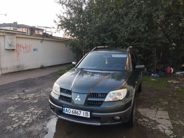 Зелений Міцубісі Аутлендер, об'ємом двигуна 2.4 л та пробігом 3 тис. км за 6500 $, фото 2 на Automoto.ua
