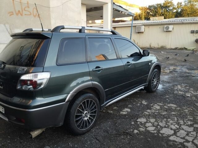 Зелений Міцубісі Аутлендер, об'ємом двигуна 2.4 л та пробігом 3 тис. км за 6500 $, фото 3 на Automoto.ua