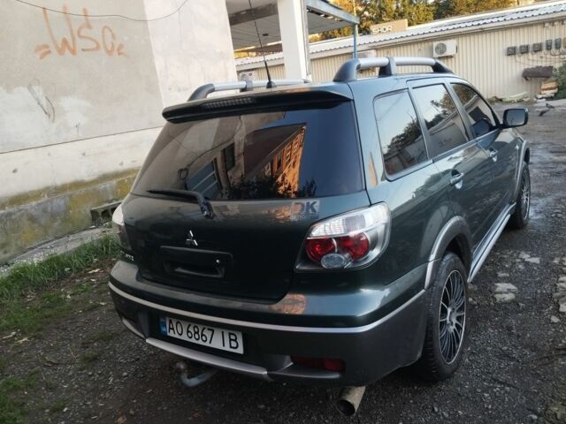 Зелений Міцубісі Аутлендер, об'ємом двигуна 2.4 л та пробігом 3 тис. км за 6500 $, фото 4 на Automoto.ua