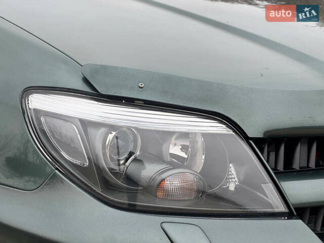 Зеленый Мицубиси Аутлендер, объемом двигателя 2 л и пробегом 194 тыс. км за 6350 $, фото 5 на Automoto.ua