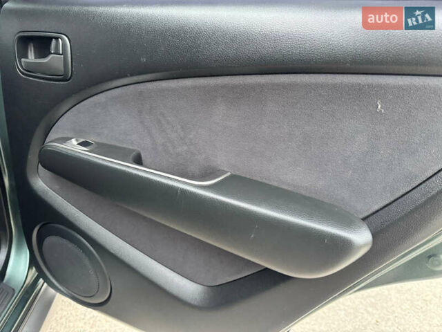 Зеленый Мицубиси Аутлендер, объемом двигателя 2 л и пробегом 194 тыс. км за 6350 $, фото 28 на Automoto.ua