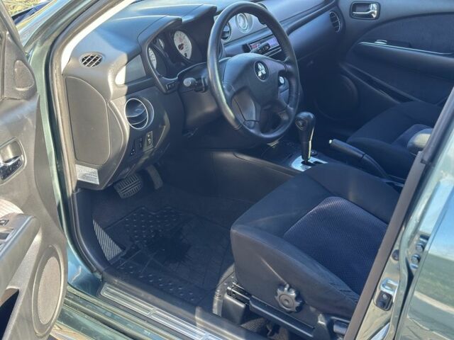 Міцубісі Аутлендер 2006 у Києві на Automoto.ua Зелений Міцубісі Аутлендер, об'ємом двигуна 2.4 л та пробігом 275 тис. км за 7350 $, фото 18 на Automoto.ua