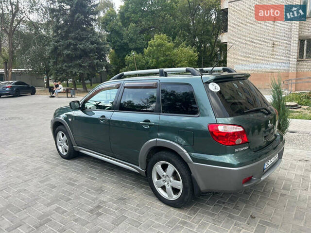 Зеленый Мицубиси Аутлендер, объемом двигателя 2.38 л и пробегом 231 тыс. км за 8000 $, фото 24 на Automoto.ua