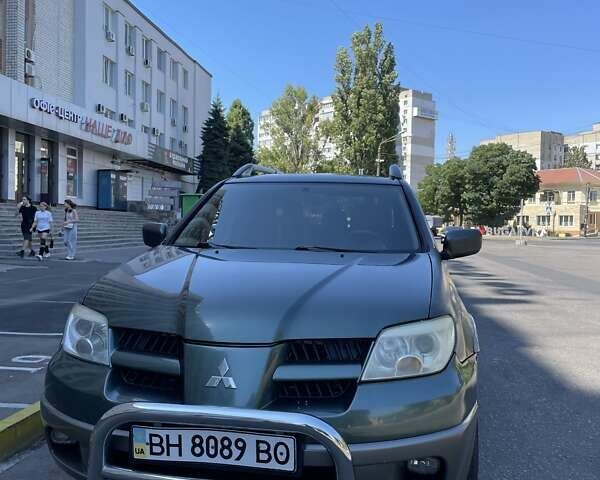 Зеленый Мицубиси Аутлендер, объемом двигателя 2.4 л и пробегом 313 тыс. км за 6200 $, фото 2 на Automoto.ua