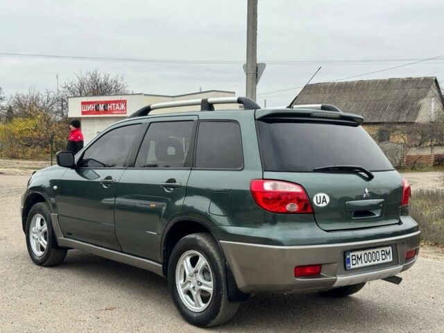 Зелений Міцубісі Аутлендер, об'ємом двигуна 2 л та пробігом 194 тис. км за 6350 $, фото 4 на Automoto.ua