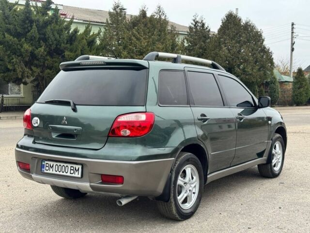 Зелений Міцубісі Аутлендер, об'ємом двигуна 2 л та пробігом 194 тис. км за 6350 $, фото 6 на Automoto.ua