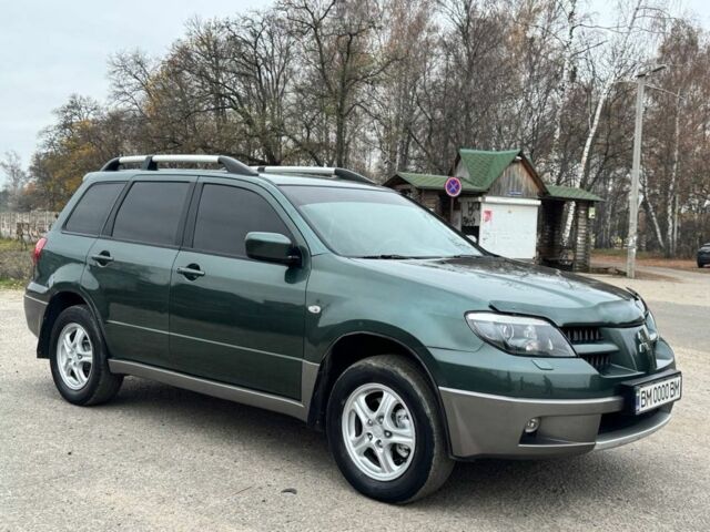 Зелений Міцубісі Аутлендер, об'ємом двигуна 2 л та пробігом 194 тис. км за 6350 $, фото 8 на Automoto.ua