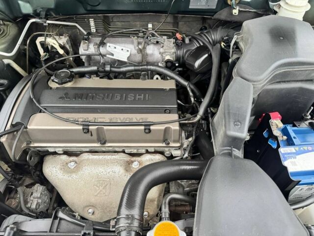 Зелений Міцубісі Аутлендер, об'ємом двигуна 2 л та пробігом 194 тис. км за 6350 $, фото 22 на Automoto.ua