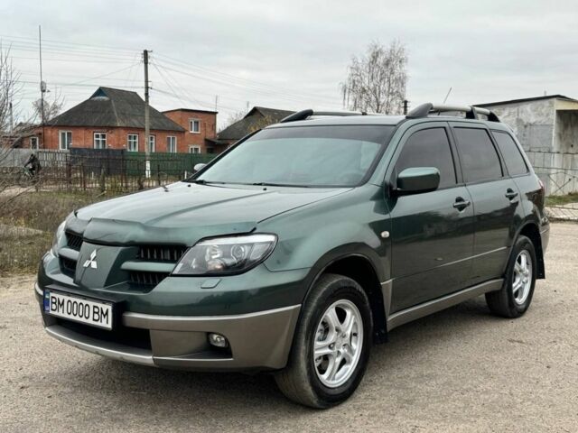 Зелений Міцубісі Аутлендер, об'ємом двигуна 2 л та пробігом 194 тис. км за 6350 $, фото 2 на Automoto.ua
