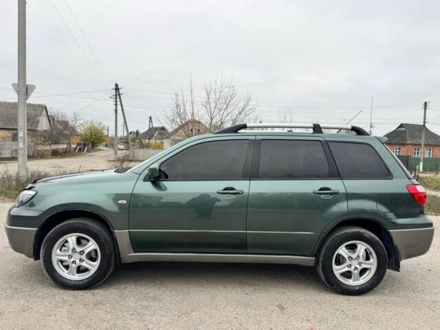 Зелений Міцубісі Аутлендер, об'ємом двигуна 2 л та пробігом 194 тис. км за 6350 $, фото 3 на Automoto.ua