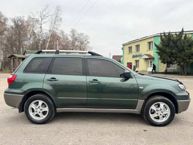 Зелений Міцубісі Аутлендер, об'ємом двигуна 2 л та пробігом 194 тис. км за 6350 $, фото 7 на Automoto.ua