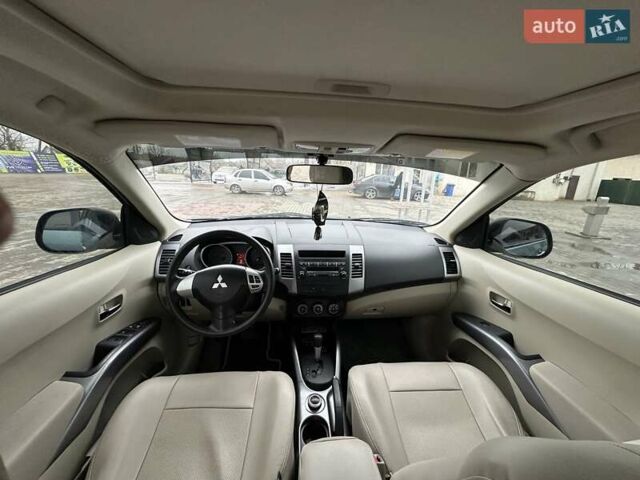 Зелений Міцубісі Аутлендер, об'ємом двигуна 2.36 л та пробігом 80 тис. км за 10500 $, фото 13 на Automoto.ua