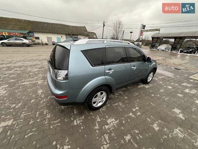 Зелений Міцубісі Аутлендер, об'ємом двигуна 2.36 л та пробігом 80 тис. км за 10500 $, фото 10 на Automoto.ua