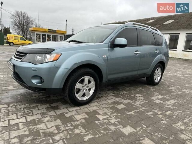 Зелений Міцубісі Аутлендер, об'ємом двигуна 2.36 л та пробігом 80 тис. км за 10500 $, фото 5 на Automoto.ua