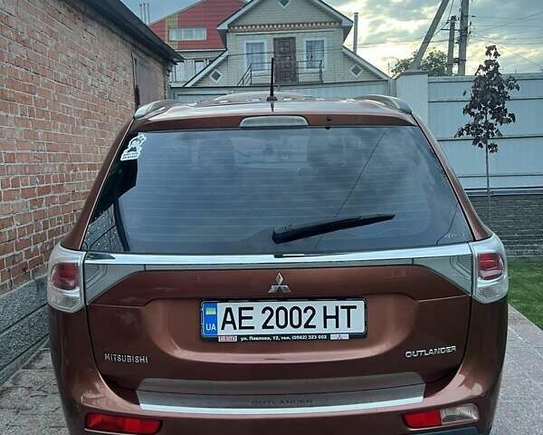 Оранжевый Мицубиси Аутлендер, объемом двигателя 2 л и пробегом 203 тыс. км за 14200 $, фото 5 на Automoto.ua
