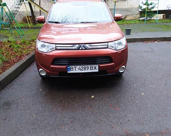 Помаранчевий Міцубісі Аутлендер, об'ємом двигуна 2.4 л та пробігом 166 тис. км за 11700 $, фото 3 на Automoto.ua