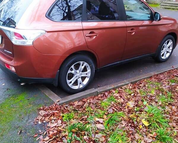 Помаранчевий Міцубісі Аутлендер, об'ємом двигуна 2.4 л та пробігом 166 тис. км за 11700 $, фото 5 на Automoto.ua