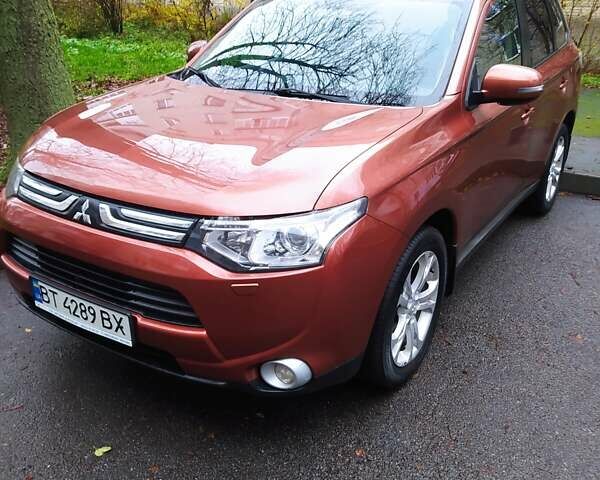 Помаранчевий Міцубісі Аутлендер, об'ємом двигуна 2.4 л та пробігом 166 тис. км за 11700 $, фото 7 на Automoto.ua