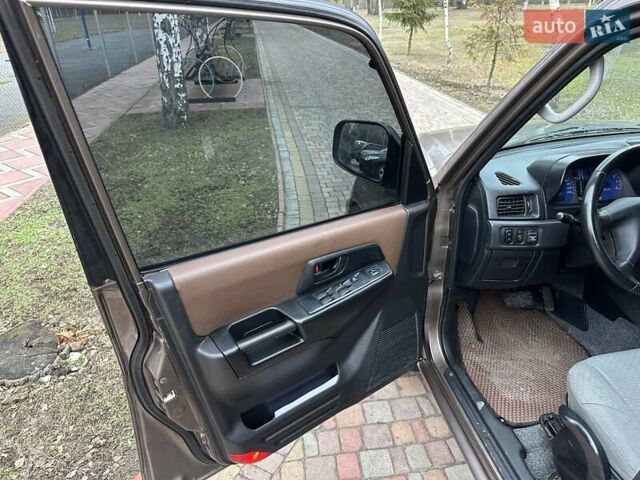 Бежевий Міцубісі Паджеро Пінін, об'ємом двигуна 1.83 л та пробігом 264 тис. км за 5750 $, фото 20 на Automoto.ua