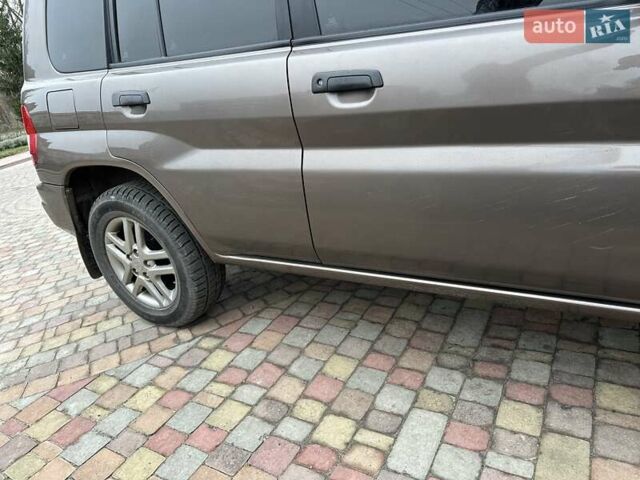 Бежевий Міцубісі Паджеро Пінін, об'ємом двигуна 1.83 л та пробігом 264 тис. км за 5750 $, фото 10 на Automoto.ua