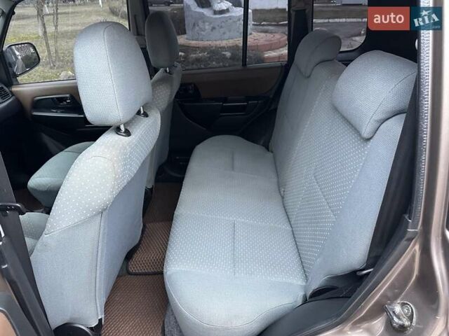 Бежевий Міцубісі Паджеро Пінін, об'ємом двигуна 1.83 л та пробігом 264 тис. км за 5750 $, фото 15 на Automoto.ua