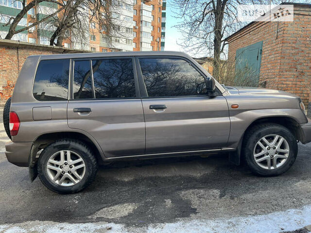 Бежевий Міцубісі Паджеро Пінін, об'ємом двигуна 1.8 л та пробігом 250 тис. км за 7000 $, фото 10 на Automoto.ua