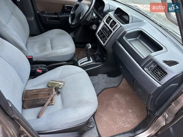 Бежевий Міцубісі Паджеро Пінін, об'ємом двигуна 1.83 л та пробігом 264 тис. км за 5750 $, фото 19 на Automoto.ua