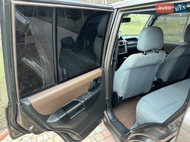 Бежевий Міцубісі Паджеро Пінін, об'ємом двигуна 1.83 л та пробігом 264 тис. км за 5750 $, фото 14 на Automoto.ua