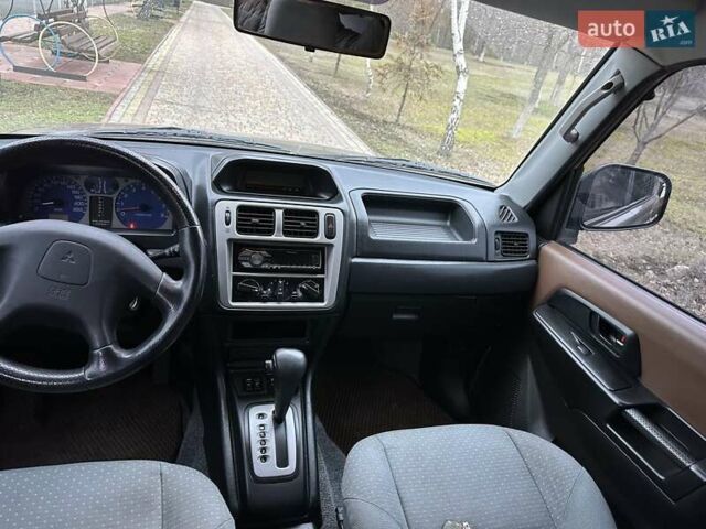 Бежевий Міцубісі Паджеро Пінін, об'ємом двигуна 1.83 л та пробігом 264 тис. км за 5750 $, фото 25 на Automoto.ua