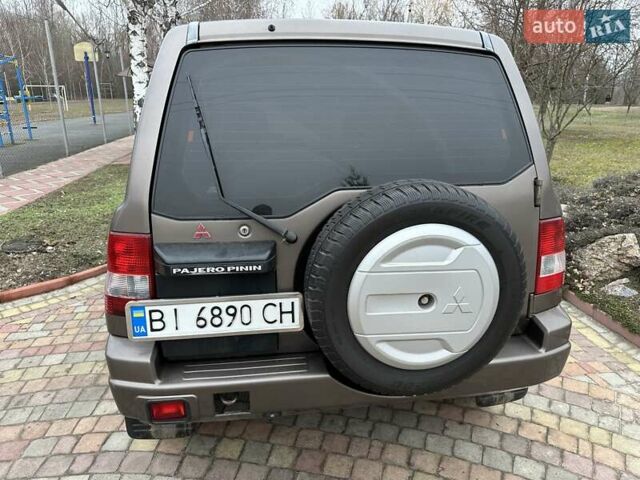 Бежевий Міцубісі Паджеро Пінін, об'ємом двигуна 1.83 л та пробігом 264 тис. км за 5750 $, фото 3 на Automoto.ua
