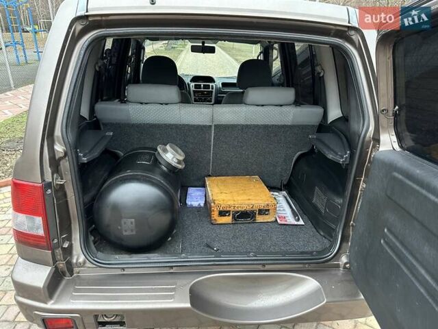 Бежевий Міцубісі Паджеро Пінін, об'ємом двигуна 1.83 л та пробігом 264 тис. км за 5750 $, фото 6 на Automoto.ua