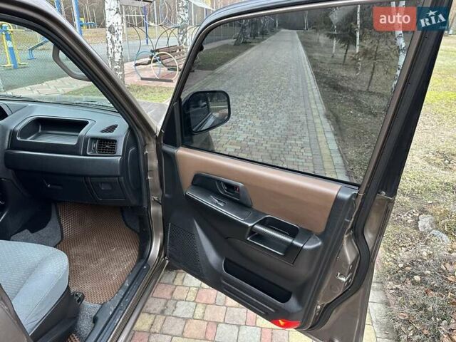 Бежевий Міцубісі Паджеро Пінін, об'ємом двигуна 1.83 л та пробігом 264 тис. км за 5750 $, фото 18 на Automoto.ua