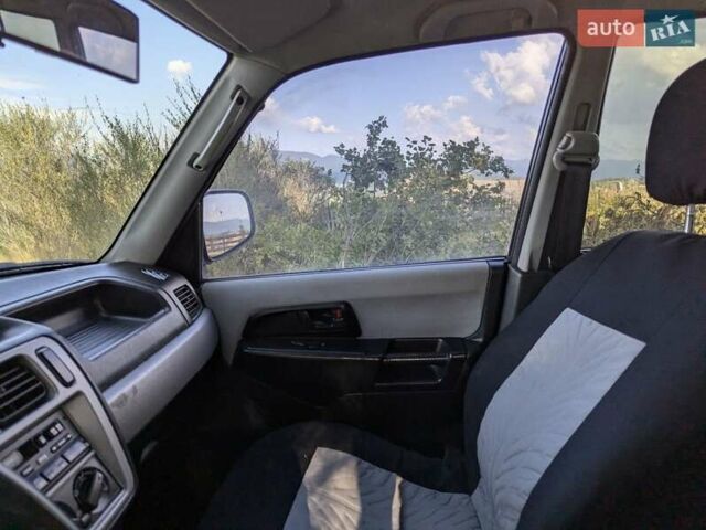 Зелений Міцубісі Паджеро Пінін, об'ємом двигуна 1.83 л та пробігом 270 тис. км за 4900 $, фото 13 на Automoto.ua