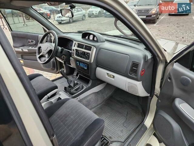 Бежевий Міцубісі Паджеро Спорт, об'ємом двигуна 2.5 л та пробігом 143 тис. км за 10800 $, фото 9 на Automoto.ua