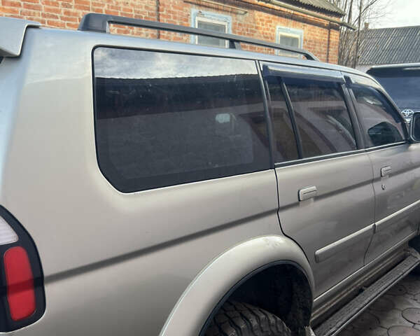 Бежевий Міцубісі Паджеро Спорт, об'ємом двигуна 3 л та пробігом 270 тис. км за 8300 $, фото 6 на Automoto.ua