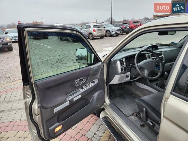 Бежевий Міцубісі Паджеро Спорт, об'ємом двигуна 2.5 л та пробігом 143 тис. км за 10800 $, фото 7 на Automoto.ua