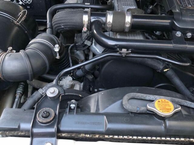 Бежевий Міцубісі Паджеро Спорт, об'ємом двигуна 2.5 л та пробігом 180 тис. км за 13000 $, фото 1 на Automoto.ua