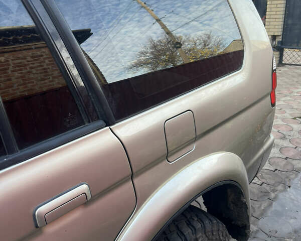 Бежевий Міцубісі Паджеро Спорт, об'ємом двигуна 3 л та пробігом 270 тис. км за 8300 $, фото 4 на Automoto.ua