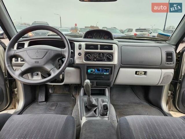 Бежевий Міцубісі Паджеро Спорт, об'ємом двигуна 2.5 л та пробігом 143 тис. км за 10800 $, фото 14 на Automoto.ua