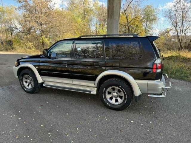 Черный Мицубиси Паджеро Спорт, объемом двигателя 3 л и пробегом 293 тыс. км за 4599 $, фото 1 на Automoto.ua