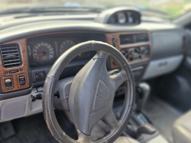 Чорний Міцубісі Паджеро Спорт, об'ємом двигуна 3 л та пробігом 278 тис. км за 6200 $, фото 8 на Automoto.ua