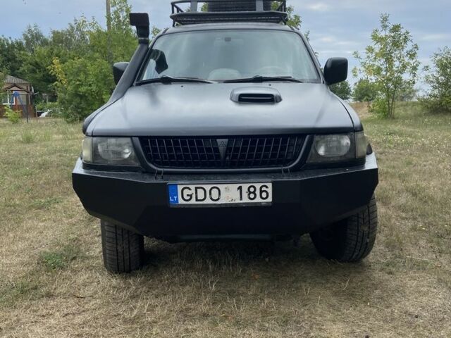 Мицубиси Паджеро Спорт 2002 в Тальном на Automoto.ua Черный Мицубиси Паджеро Спорт, объемом двигателя 2.5 л и пробегом 200 тыс. км за 3600 $, фото 1 на Automoto.ua