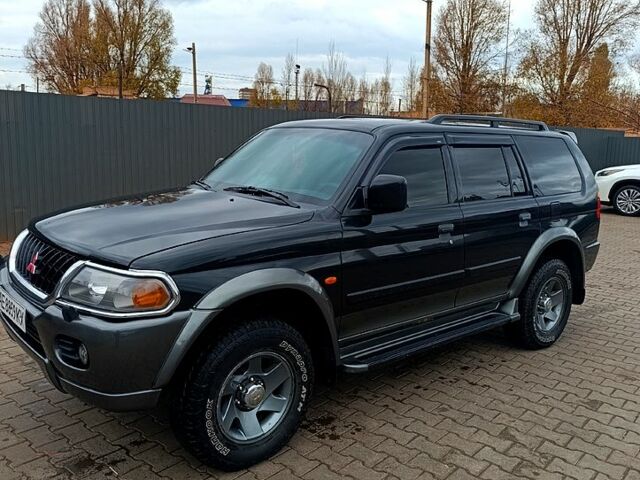 Чорний Міцубісі Паджеро Спорт, об'ємом двигуна 3 л та пробігом 270 тис. км за 6200 $, фото 10 на Automoto.ua