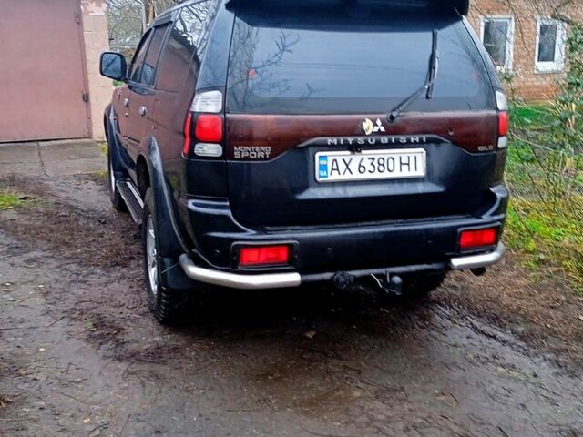 Чорний Міцубісі Паджеро Спорт, об'ємом двигуна 2.5 л та пробігом 207 тис. км за 7000 $, фото 2 на Automoto.ua
