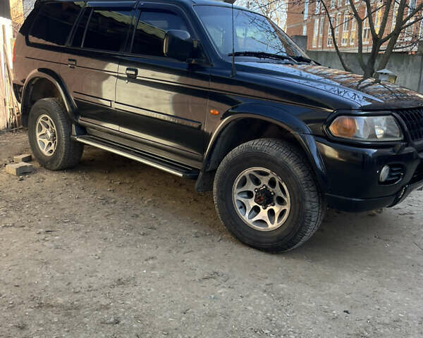 Чорний Міцубісі Паджеро Спорт, об'ємом двигуна 3 л та пробігом 313 тис. км за 6999 $, фото 2 на Automoto.ua
