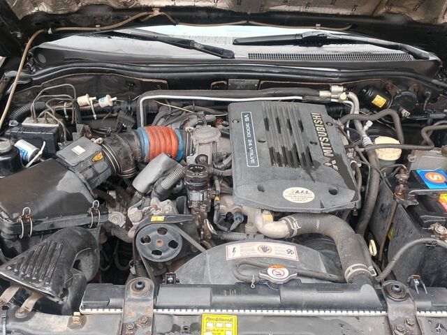 Черный Мицубиси Паджеро Спорт, объемом двигателя 3 л и пробегом 300 тыс. км за 7500 $, фото 8 на Automoto.ua