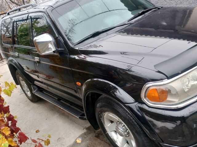 Черный Мицубиси Паджеро Спорт, объемом двигателя 3 л и пробегом 300 тыс. км за 7500 $, фото 2 на Automoto.ua