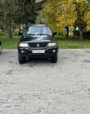 Чорний Міцубісі Паджеро Спорт, об'ємом двигуна 3 л та пробігом 313 тис. км за 6999 $, фото 5 на Automoto.ua